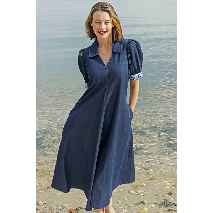 A denim midi length dress with puffed sleeves