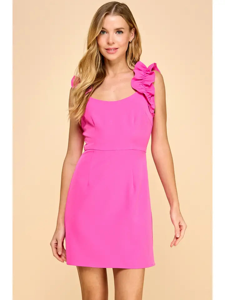 A hot pink dress with a scoop neckline and delicate ruffles.