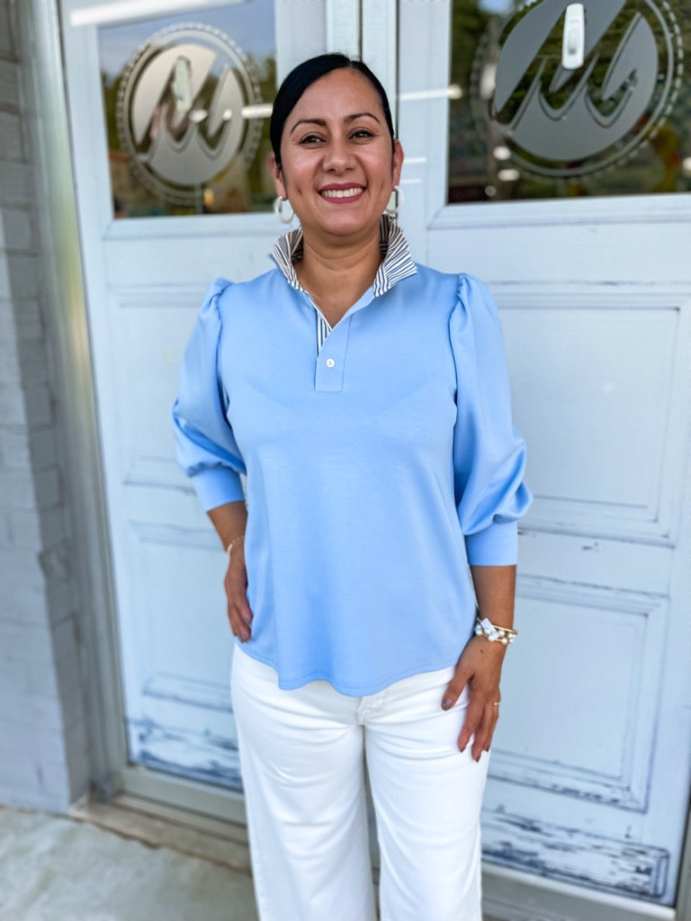 Jamesy top in blue with 3/4 balloon sleeves and contrast ruffle neck.