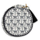 Circular pouch with black bow pattern on a white background