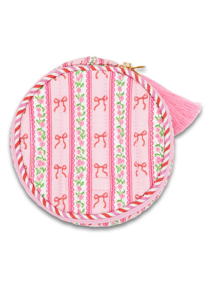 Pink pouch with bow pattern on a white background
