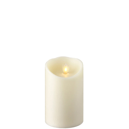 Fake white candle with moving flame, made from wax, 3.5" X 5" in size. 
