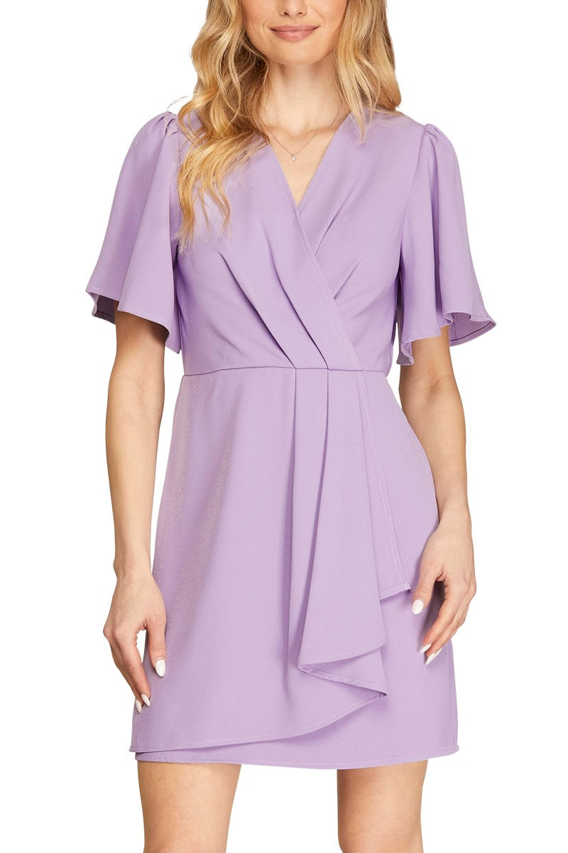 A lavender dress with a ruffled wrap design and short sleeves