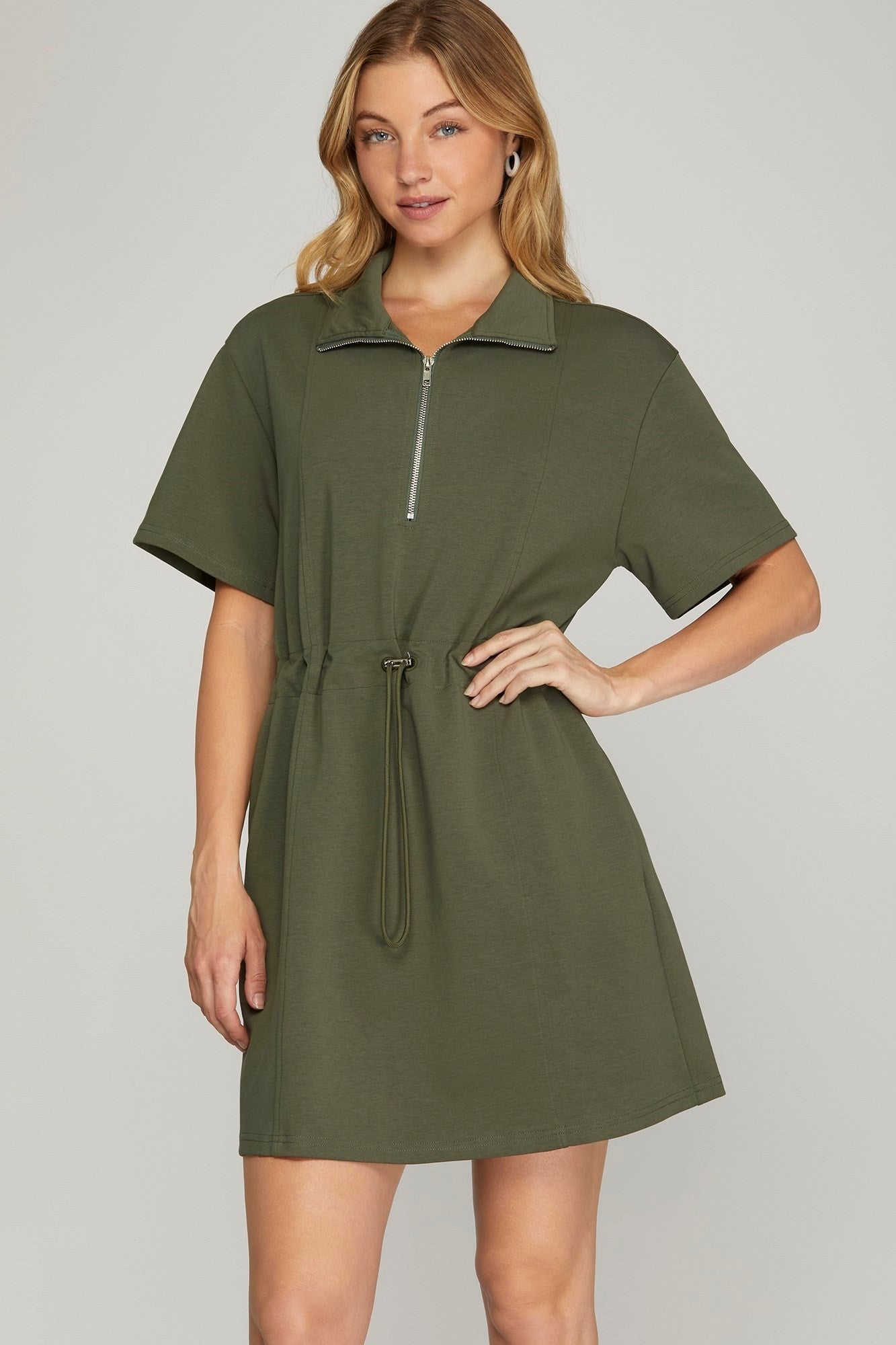 A olive green dress with half sleeves and a drawstring waist