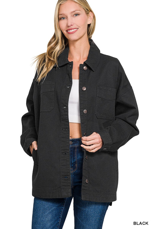 A black oversized shacket, featuring buttons down the front.