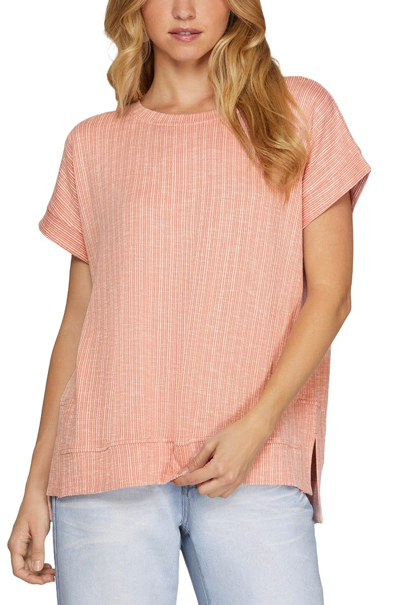 A pink short sleeve ribbed knit top