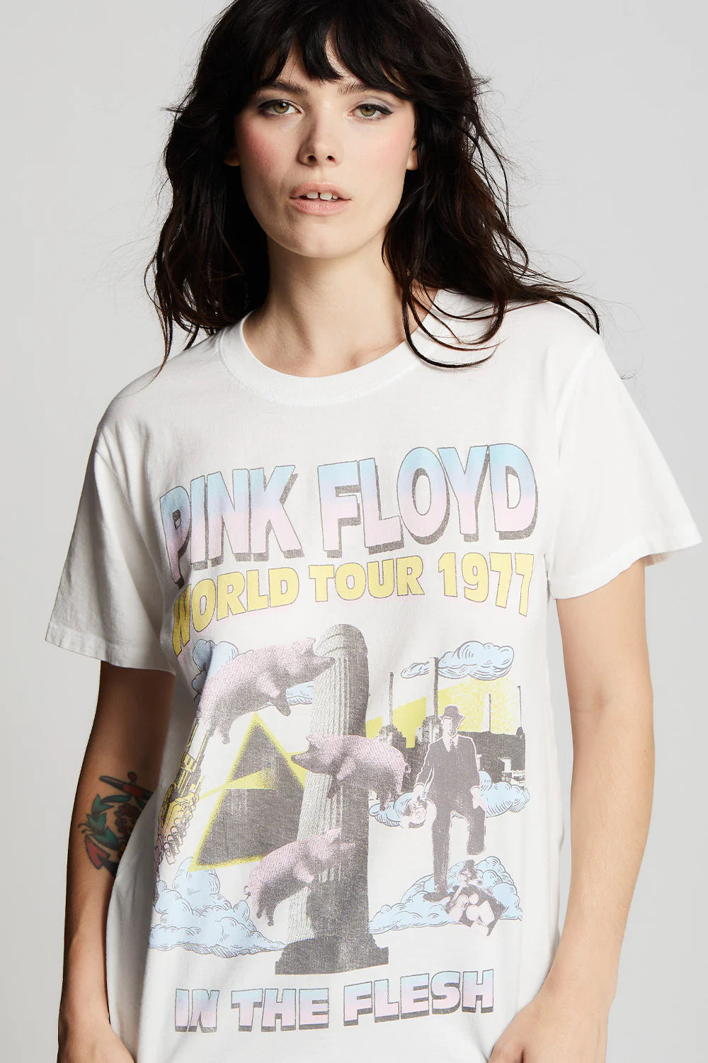 Reveal your fan spirit for the English rock band Pink Floyd with this “In The Flesh” tour tee.The “In the Flesh Tour” rocked its way through North America and Europe from January to July 1977.Made from our unique cotton fabric with a crew neckline, oversized unisex fit, and distressed graphics.