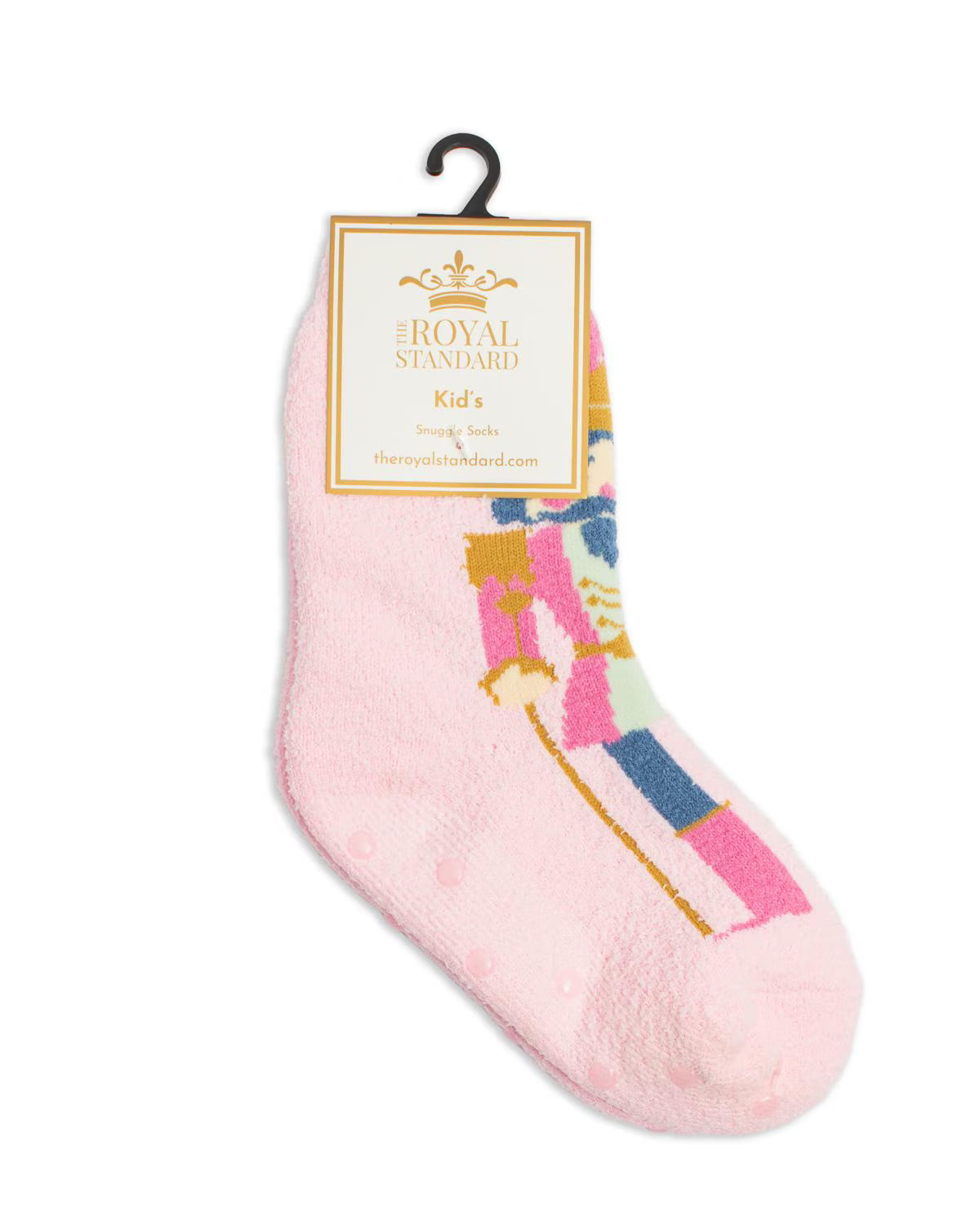 A single pink fuzzy sock for kids with a colorful nutcracker graphic, hanging from a black hanger with a Royal Standard brand tag.