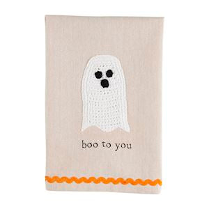 A Halloween crochet tea towel with a white ghost with the words "boo to you" underneath and orange rickrack trim