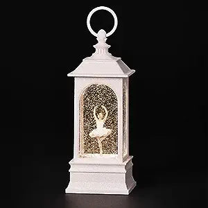 Water lantern with LED lights and glitter, with ballerina twirling in the middle. 