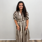 Women’s brown and cream vertically striped midi shirt dress featuring a collared neckline, button-front closure, short puff sleeves, side pockets, and a coordinating belted waist.