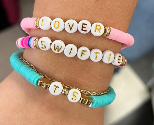 Taylor Swift lettered friendship bracelets.