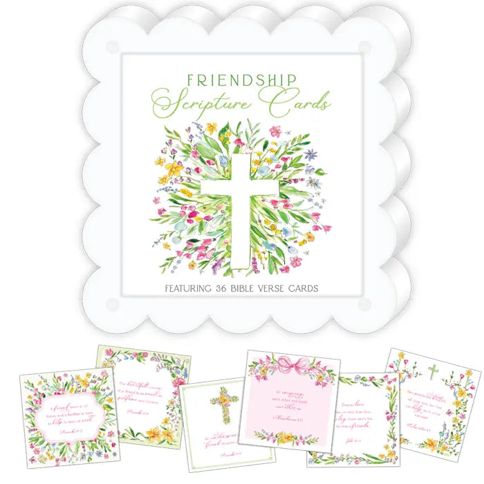 Friendship Scripture Cards set featuring a white scalloped card holder with a floral cross illustration, surrounded by several sample verse cards in pastel pink, green, yellow, and white floral designs.
