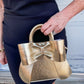 Metallic Bow Front Top Handle Clutch