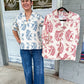 Shyann top with smocking detail with 3/4 length sleeves with a paisley print in red mix.
