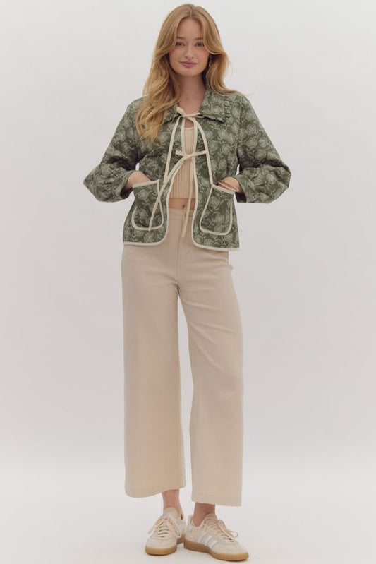 Long-sleeved, green top tied together with strings and front pockets