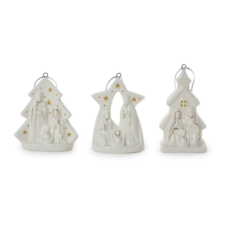 Set of three white ceramic nativity ornaments featuring Mary, Joseph, and baby Jesus in Christmas tree, star, and church designs with gold accents and silver hanging loops.