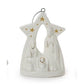 White ceramic nativity ornament shaped like a star, featuring Mary, Joseph, and baby Jesus with gold star and dot accents and a silver hanging loop.