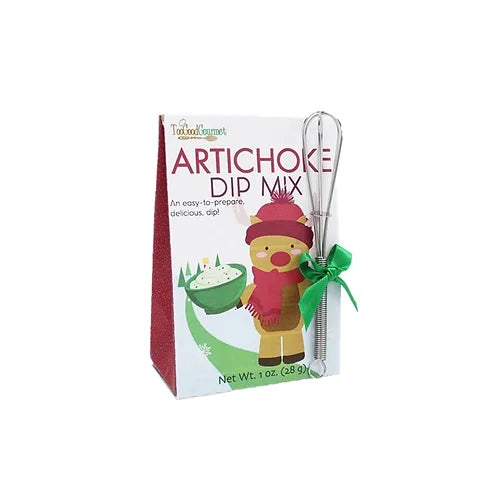 Artichoke dip mix in a festive illustrated box, accompanied by a small metal whisk tied with a green ribbon.