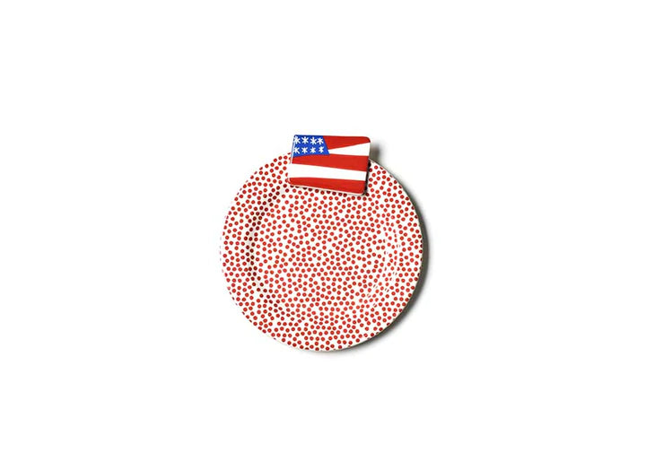 Mini desert serving plate, white base with red small dots with small ceramic American Flag at the top of the plate.