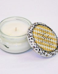 Small white candle by Tyler Candle Company with a cheetah screw top, in the scent Platinum..