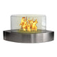 Glass tabletop fireplace, with oval teardrop design. Metal base with glass sides.
