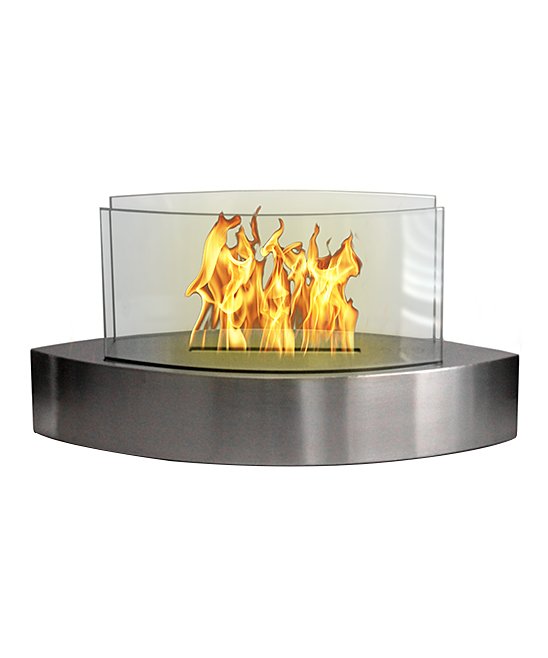 Glass tabletop fireplace, with oval teardrop design. Metal base with glass sides.